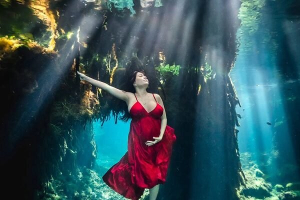 Graceful underwater portraits for celebrating motherhood