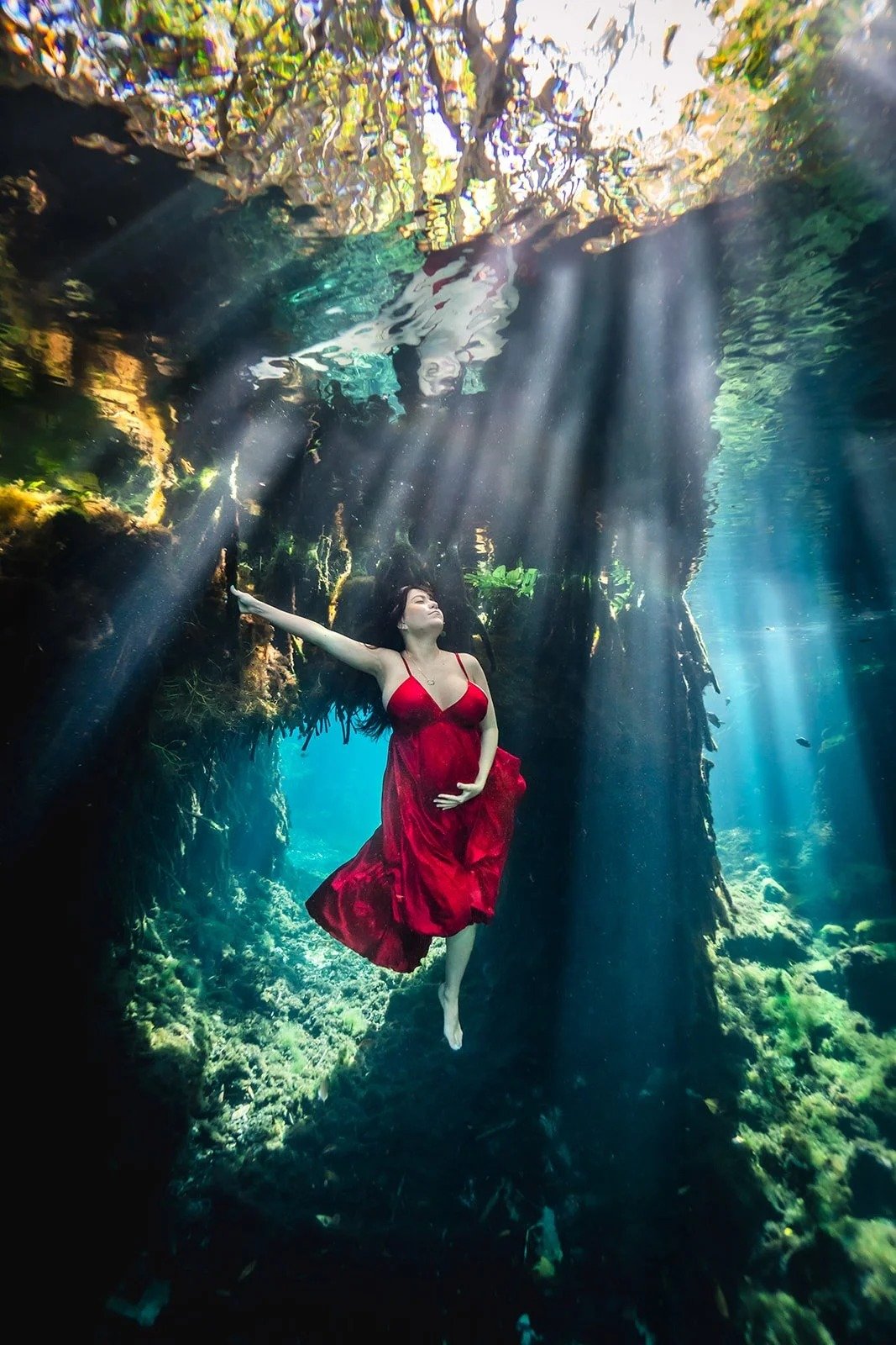 Graceful underwater portraits for celebrating motherhood